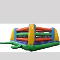 Colorful inflatable boxing ring in yellow, blue, red, and green